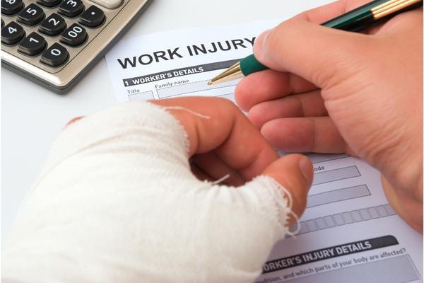 injured worker fills out work injury claim form