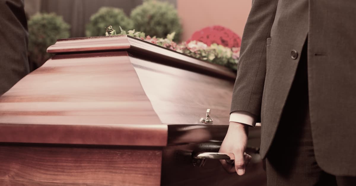 Pallbearers carrying a coffin | Alexander Shunnarah Trial Attorneys
