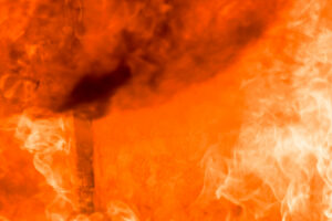 Flames destroy a full structure with fire damage.