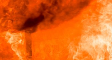 Flames destroy a full structure with fire damage.