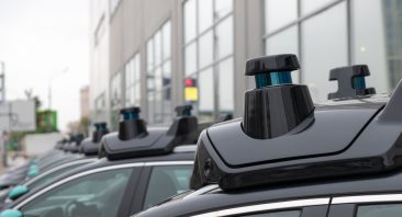 A line of robotaxi vehicles.