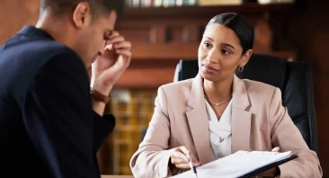 A grieving family member meets with an Alabama wrongful death lawyer at a law office to discuss their legal options after losing a loved one.