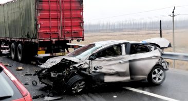 The photo shows the aftermath of a dangerous truck wreck to illustrate when someone may need a Birmingham truck accident lawyer.