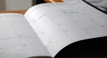 A calendar with multiple dates marked, illustrating the car accident lawsuit timeline.