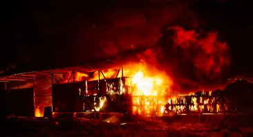 Large blaze at burning industrial building.