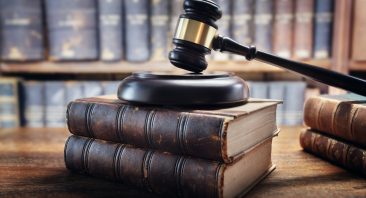 Judge gavel and law books in court, law and justice background concept