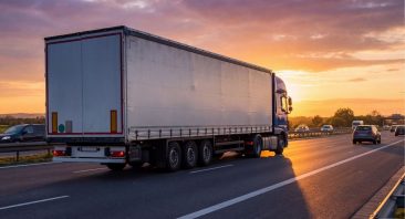 A truck travels down an interstate, illustrating the concept of a black box in a truck, recording its speed.