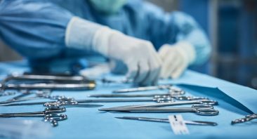 Surgical instruments being counted on a tray in an operating room, illustrating res ipsa loquitur in medical malpractice.
